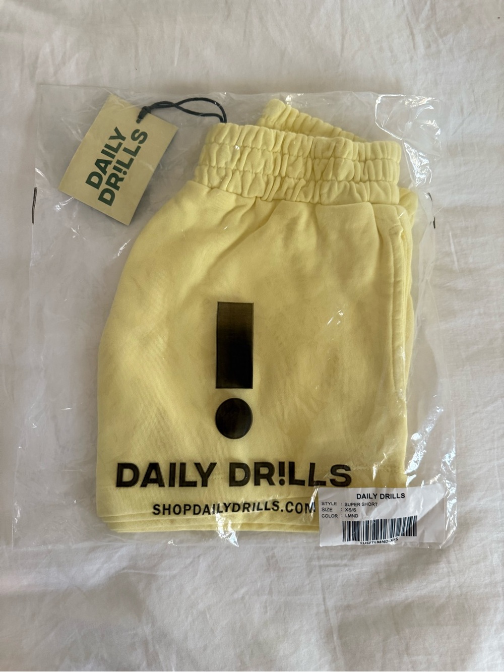 Daily Drills Pale Yellow Logo Shorts